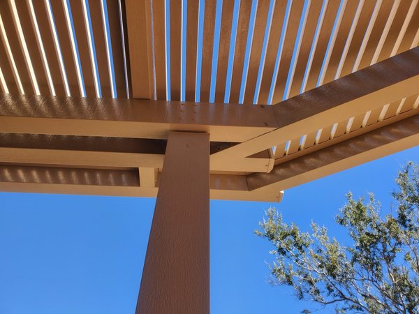 Tan aluminum lattice patio cover detail for Anthem area shade projects.
