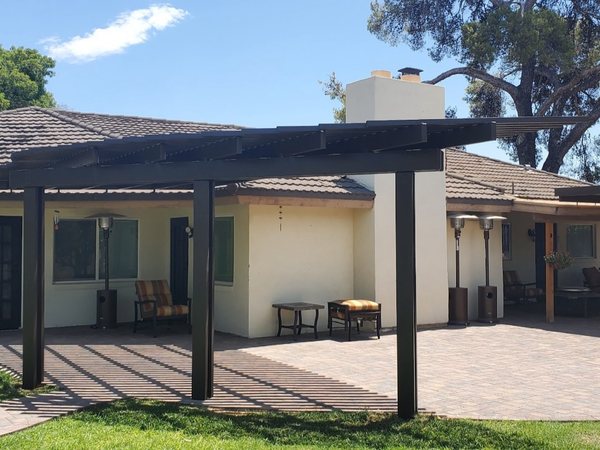 Dark attached solid patio cover for Green Valley area homes.