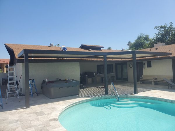 Poolside attached dark patio cover for Las Vegas area outdoor living.