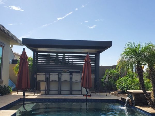 Poolside patio cover with privacy screen for Lake Las Vegas area homes.