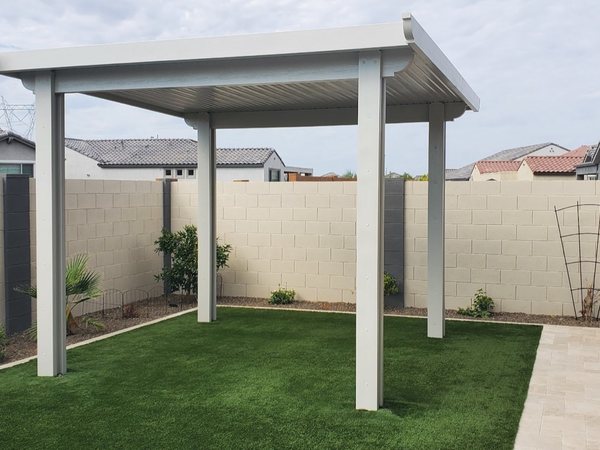 White freestanding aluminum patio cover on turf for Centennial Hills area homes.